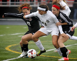 MADELYN P. HASTINGS | THE VINDICATOR..Canfield's Anita Mancini (22) and Sophia Mancini (12) fight for the ball against Hathaway Brown's Sabrina Kunimoto (41) during their game at Brecksville-Broadview Heights High School on November 2, 2013. ... - -30-..