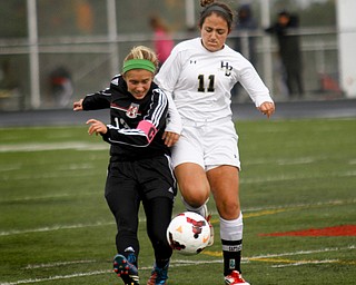 MADELYN P. HASTINGS | THE VINDICATOR..Canfield's Elena Billy (13) and Hathaway Brown's Claire Danes (11) fight for the ball during their game at Brecksville-Broadview Heights High School on November 2, 2013. ... - -30-..