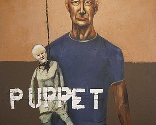 MADELYN P. HASTINGS | THE VINDICATOR..Part of the discussion during a press event involved the use of the word "puppet" in one of John Mellencamp's paintings. He began the event by crossing out the word with a marker. ... - -30-..