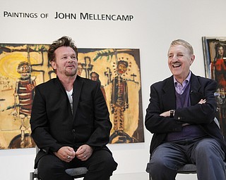 MADELYN P. HASTINGS | THE VINDICATOR..(L-R) John Mellencamp and director of Butler, Louis Zona, discusses Mellencamp's painting during a reception to mark the opening of his exhibition at the Butler Museum of Art in Howland on November 2, 2013. ... - -30-..