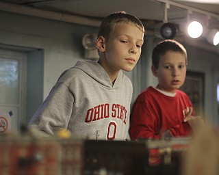 Siblings Clayton (9) and Blake (11) Marcum of Austintown watch the model trains during the 2013 Youngstown Model Railroad Assosiation openhouse in Austintown on Saturday. Dustin Livesay | The Vindicator 11/2/13 Austintown.