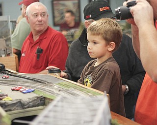 Karl Krol (4) of Lake Milton watches a trains go through a model of old steel mills during the 2013 Youngstown Model Railroad Assosiation openhouse in Austintown on Saturday. Dustin Livesay | The Vindicator 11/2/13 Austintown.