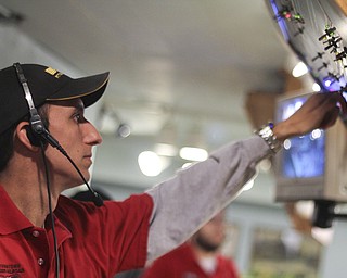 Craig Ziobert of the Youngstown Model Railroad Association adjusts switches on the control board of a model train set during the 2013 Youngstown Model Railroad Assosiation openhouse in Austintown on Saturday. Dustin Livesay | The Vindicator 11/2/13 Austintown.