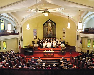 Congregation members listen to a sermon by the Rev. Peter Lawson during the dedication ceremony Sunday at John Knox Presbyterian Church on Market Street on Youngstown’s South Side. The church is expected to close by the end of this month.