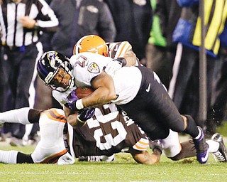 Ravens running back Ray Rice (2) is tackled by Browns cornerback Joe Haden (23) and inside linebacker Craig Robertson on the final play of the Browns’ 24-18 win Sunday at Cleveland’s FirstEnergy Stadium.