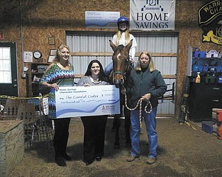 SPECIAL TO THE VINDICATOR
Homes Savings Charitable Foundation has donated $5,000 to The Camelot Center for its capital improvement project. The nonprofit Southington center operates programs that use horseback riding as therapy for children and adults who have physical, mental, emotional and learning disabilities. From left are Nicolette Darkangelo, president of The Camelot Center; Traci Vigorito, retail manager of Home Savings’ Howland office; Stephanie Maynard, student and volunteer, Camelot Center; and Debbie Meeker, director of Camelot.