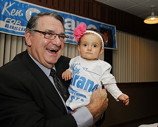 MADELYN P. HASTINGS I THE VINDICATOR..Ken Carano holds his 9 month old granddaughter, Josie, at his election party at Rachel's in Austintown on November 5, 2013.