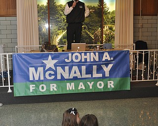 ROBERT K. YOSAY | THE VINDICATOR.. watching the winners Olivia Ciavarella 7 and Casey McNally 7 ( daughter ) John McNally thanks his supporters after McNally won the Mayors race in Youngstown at Sts. Peter and Paul Ukrainian Church, on Belle Vista Ave., Youngstown...-30-....