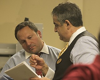 ROBERT K. YOSAY | THE VINDICATOR..Mike Scortino and Dave Betras talk over the results of the absentee ballots at the Board of Elections ..-30-....