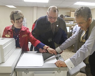 ROBERT K. YOSAY | THE VINDICATOR..Joyce Kale Pesta - Bob Wasko and Dave Betras look over the absentee results at the Mahoning County Board of Elections..-30-....