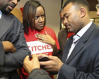 William d Lewis The Vindicator DeMaine Kitchen checks election results as his wife Leslie Kitchen reacts to the results during election night party in downtown Youngstown. HE LOST.