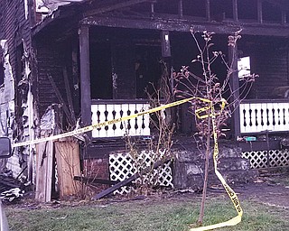 Warped siding and charred wood show the effects of a Wednesday morning fire at this 532 Dorothy Ave. home that killed a 38-year-old woman and badly burned a man. Fire investigators still are trying to determine a cause, but they are leaning toward its being accidental.