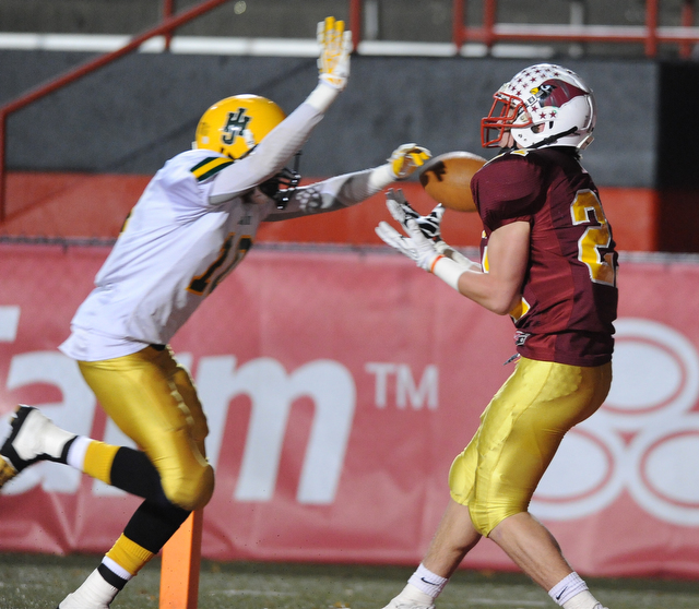 Mooney #21 Tim Durkin catches a pass in the end zone for a touchdown after getting behind John Hay #10 Treyvon Akins during the 3rd quarter of Friday nights game.
