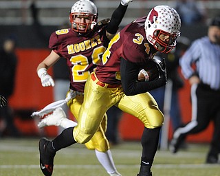 Mooney #34 Jordan Jones runs with the football after picking up a fumble after a strip on a kickoff return during the 3rd quarter of Friday nights game. Mooney #29 Joe Kleeh pictured.