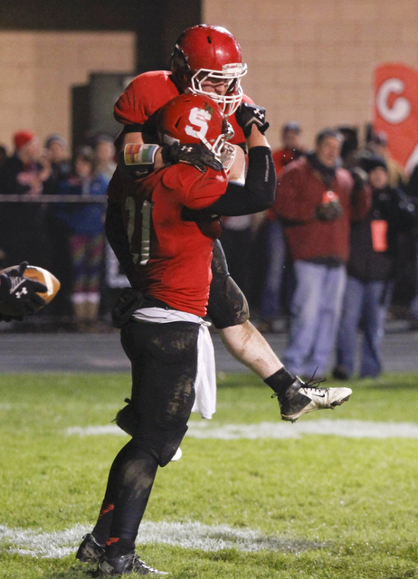        ROBERT K. YOSAY  | THE VINDICATOR..Struthers #34  Jay King jumps into Luke Witkowski arms after Luke ran the TD that put struthers ahead in the third quarter and they never looked back... - -30-.......