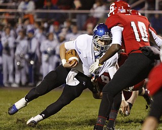 ROBERT K. YOSAY | THE VINDICATOR...Lakeviews #12 Angelo Marion Gets stopped at the line by Struthers #10 Temeko Hughes and #17 Braxton Kupp (hidden) during second quarter action at Struthers .. - -30-.......