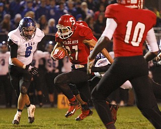 ROBERT K. YOSAY | THE VINDICATOR...Struthers #27 Luke Witkowski breaks through the line and a first down as Lakeviews #6 Chris Romano and Struthers #10 Temeko Holness look on.. - -30-.......