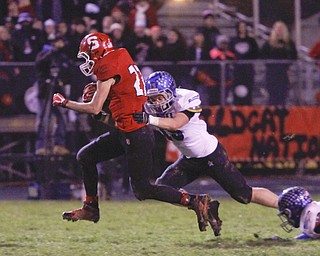ROBERT K. YOSAY | THE VINDICATOR..Struthers #27 Luke Witkowski drags Lakeview #15 John Guinn as he goes for a first down in the Third quarter that set up him scoring on the next play... - -30-.......