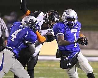 william D. Lewis | The Vindicator .Hubbard's Darnell Tate(1) scampers for yardageas George Hill(4) blocks during 1st half playoff action 11-8-13 at hubbard.