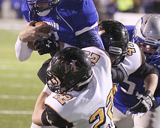william D. Lewis | The Vindicator .Hubbard's Brennan Wassil (7) is stopped by Marlington's Tyler Tokos(22) during 1rst half playoff action at Hubbard 11082013.