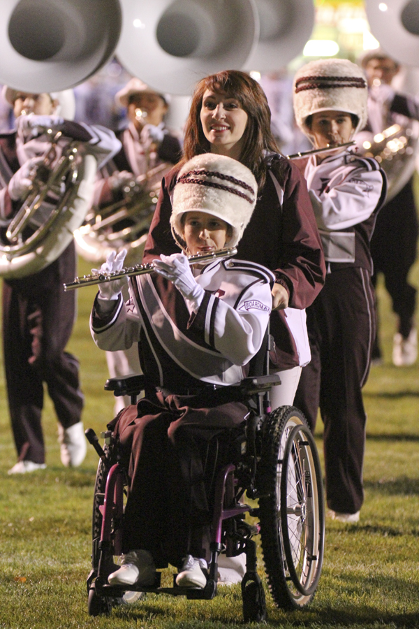 William D LEwis The Vindicator Boardman band member Kaitlin Windt, in wheelchair,  gets help from Rachael Ruggieri during 11012013 halftime show.