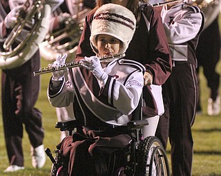 William D LEwis The Vindicator Boardman band member Kaitlin Windt, in wheelchair, gets help from Rachael Ruggieri during 11012013 halftime show.