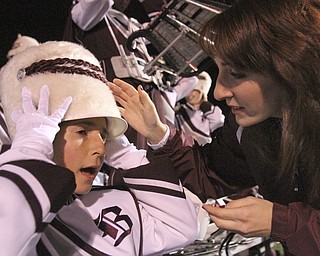 William D LEwis The Vindicator Boardman band member Kaitlin Windt, in wheelchair, gets help with her hat from Rachel Ruggieri before 11012013 halftime show.