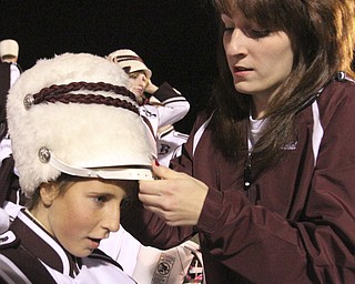 William D LEwis The Vindicator Boardman band member Kaitlin Windt, in wheelchair, gets help with her hat from Rachel Ruggieri before 11012013 halftime show.