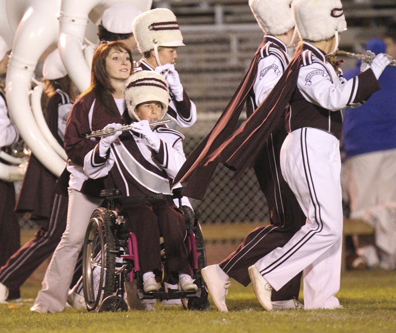 William D LEwis The Vindicator Boardman band member Kaitlin Windt, in wheelchair,  gets help from Rachel Ruggieri during 11012013 halftime show.
