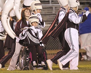William D LEwis The Vindicator Boardman band member Kaitlin Windt, in wheelchair, gets help from Rachel Ruggieri during 11012013 halftime show.