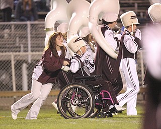 William D LEwis The Vindicator Boardman band member Kaitlin Windt, in wheelchair, gets help from Rachel Ruggieri during 11012013 halftime show.