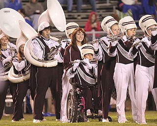 William D LEwis The Vindicator Boardman band member Kaitlin Windt, in wheelchair, gets help from Rachael Ruggieri during 11012013 halftime show.