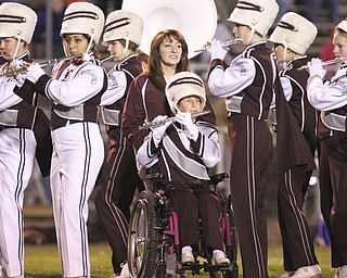 William D LEwis The Vindicator Boardman band member Kaitlin Windt, in wheelchair, gets help from Rachel Ruggieri during 11012013 halftime show.