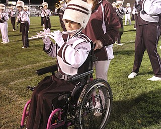 William D LEwis The Vindicator Boardman band member Kaitlin Windt, in wheelchair, gets help from Rachel Ruggieri during 11012013 halftime show.