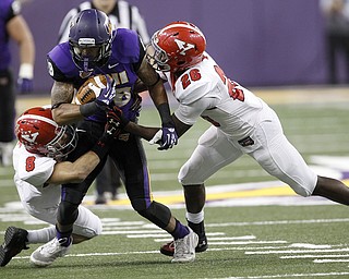 Northern Iowa's Kevin Vereen is tackled by Youngstown State's Donald D'Alesio (#8) and Jameel Smith in the second quarter of the game at the UNI-Dome in Cedar Falls, Iowa, Saturday, Nov. 9, 2013.