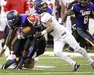 Northern Iowa quarterback Brion Carnes is tackled by tackled by Youngstown State's Dale Peterman in the second half of the game at the UNI-Dome in Cedar Falls, Iowa, Saturday, Nov. 9, 2013.