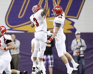 Youngstown State quarterback Kenny Bishop celebrates his touchdown with Teven Williams in the first half of the game at the UNI-Dome in Cedar Falls, Iowa, Saturday, Nov. 9, 2013.