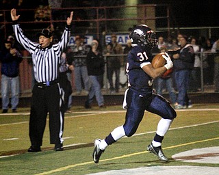 MADELYN P. HASTINGS | THE VINDICATOR..Fitch's Tyler Hewlett (31) scores a touchdown during their game against Marysville on November 9, 2013.... - -30-..