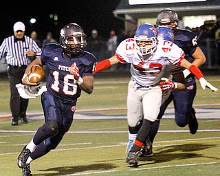 MADELYN P. HASTINGS | THE VINDICATOR..Fitch's Antwan Harris (18) runs with the ball while Marysville's Jesse Ramirez (43) chases after him during their game on November 9, 2013.... - -30-..