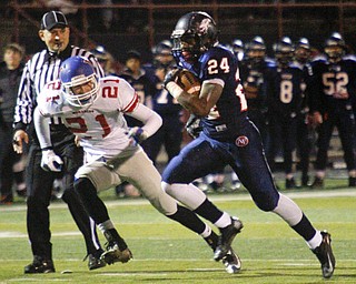 MADELYN P. HASTINGS | THE VINDICATOR..Fitch's Darrin Hall (24) runs with the ball and goes on to score their first touchdown while Marysville's Alec Draughon (21) chases after him during their game on November 9, 2013.... - -30-..