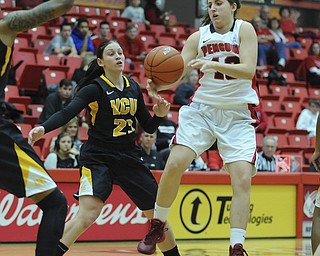 Youngstown State #13 Kelsea Newman misplays th basketball while jumping in the air while being pressured by VCU #23 Jessica Pellechio.