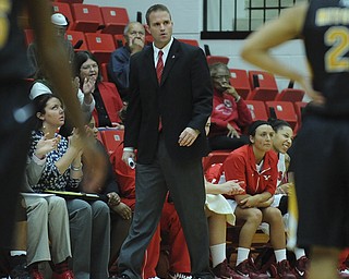 Youngstown State head coach John Barnes walks in front of the YSU bench during the first half of Saturday afternoons game.