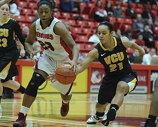 Youngstown #23 Melissa Thompson has the ball slapped out of her hand by VCU #21 Ashlee Mitchell during the first half of Saturday afternoons game.