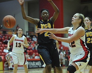 Youngstown State #22 Ashley Lawson passes the ball to avoid being trapped in the corner by VCU defender #2 Monnanjea Finney-Smith during the first half of Saturday afternoons game.