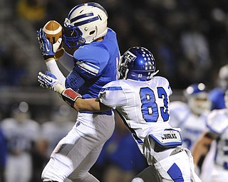 Reserve #11 Joe Falasca catches a pass after getting to the inside of Trinity defensive back #83 Jacob Walters during the 1st quarter of Saturday nights game.