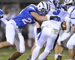 Reserve #24 Nick Tobin tackles Trinity running back Matt Iacobucci during the 2nd quarter of Saturday nights game.