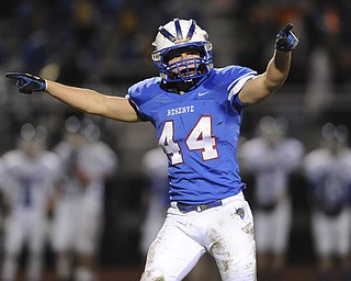 Reserve #44 Dan Zilke celebrates after breaking up a Trinity pass on 4th down in the 2nd quarter during Saturday nights game.