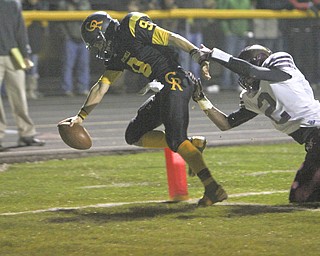 Crestview's Collin Gilbert (9) reaches across the goalline before being tackled by Liberty's Asim Pleas (2) during the second quarter of Saturday's OHSAA playoff game at Crestview High School. Dustin Livesay | The Vindicator 11/9/13 Crestview High School.