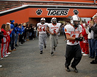 MADELYN P. HASTINGS | THE VINDICATOR..The Sharon High School football team walks out onto the field from their locker room with support from family and friends before their first football practice since the fatal car accident Friday night, killing two of their teammates. Their playoff game was rescheduled for Monday.... - -30-..