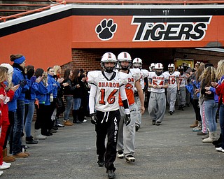 MADELYN P. HASTINGS | THE VINDICATOR..The Sharon High School football team walks out onto the field from their locker room with support from family and friends before their first football practice since the fatal car accident Friday night, killing two of their teammates. Their playoff game was rescheduled for Monday.... - -30-..